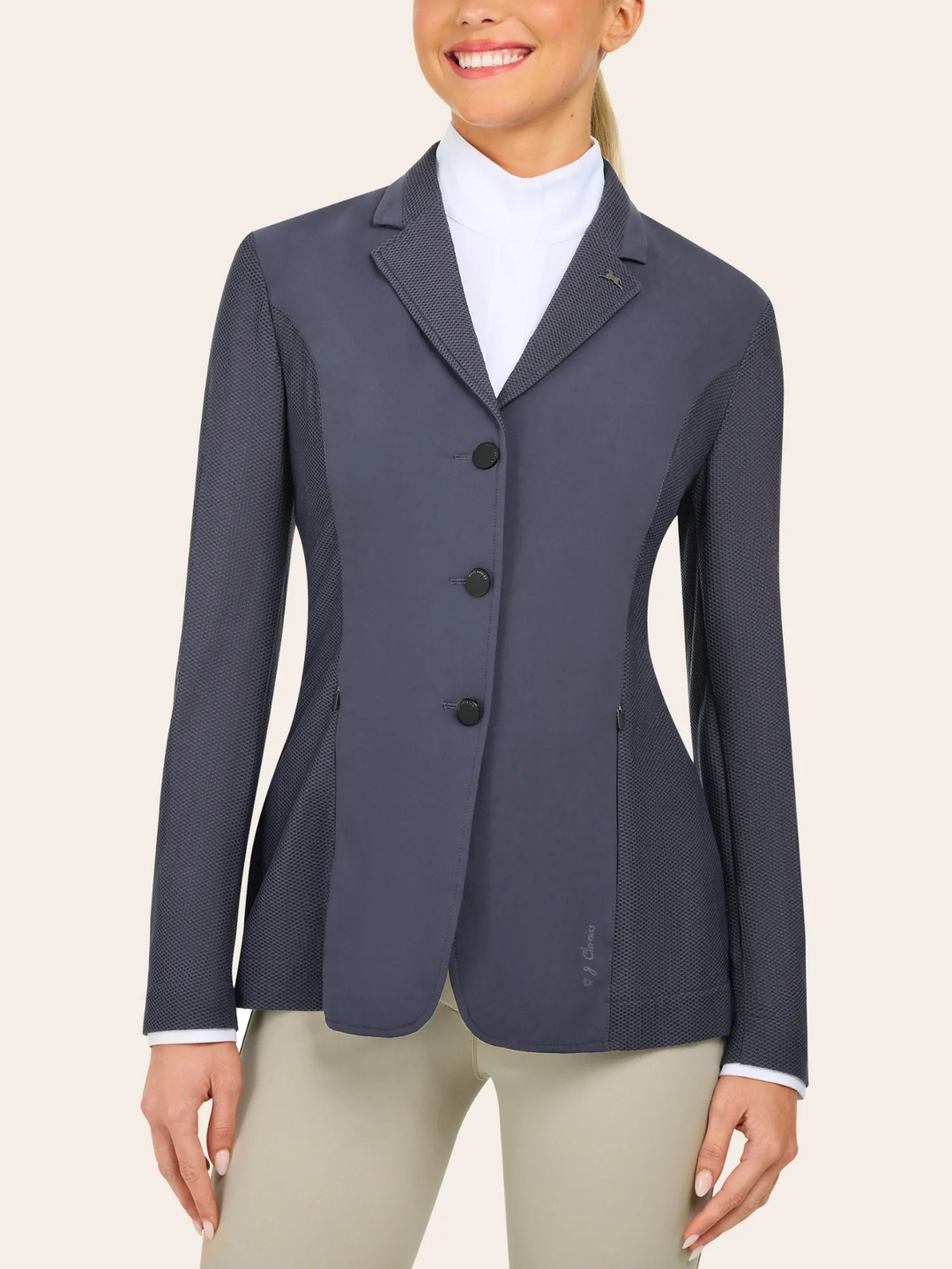 Women wearing white show shirt, navy show coat and tan breeches
